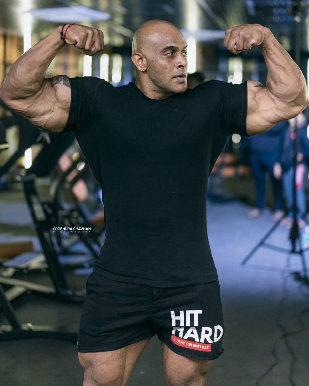 Strong Soul black ribbed slim fit t-shirt and black 'Hit Hard' training shorts worn by a muscular man posing in a gym.