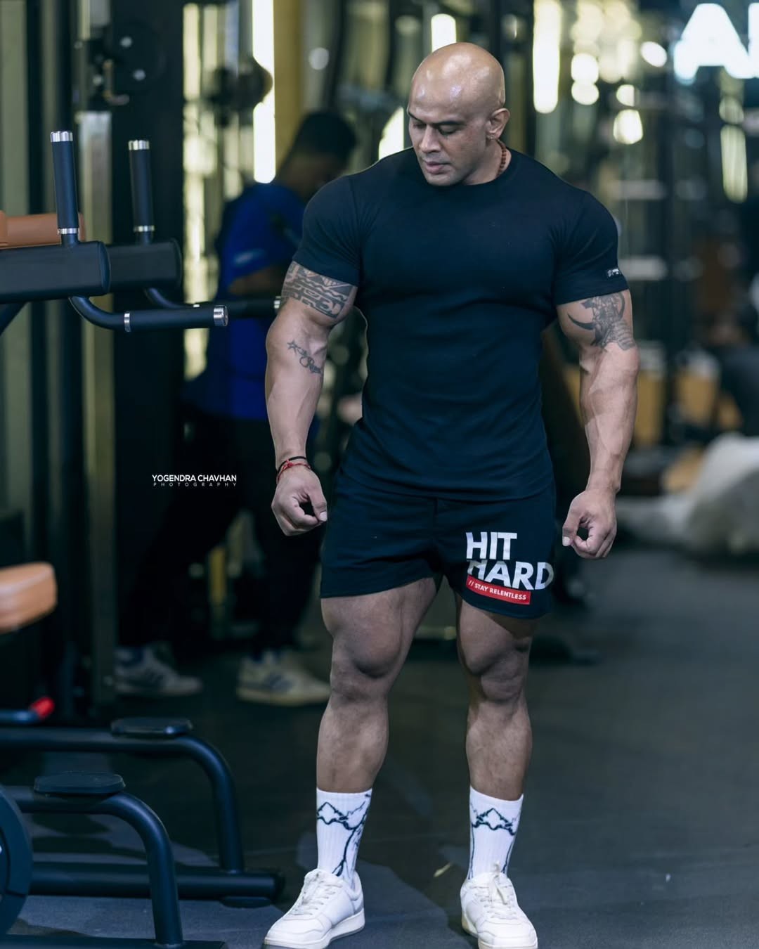 Strong Soul men's black ribbed slim fit t-shirt and black training shorts with 'HIT HARD' graphic. Model in gym.